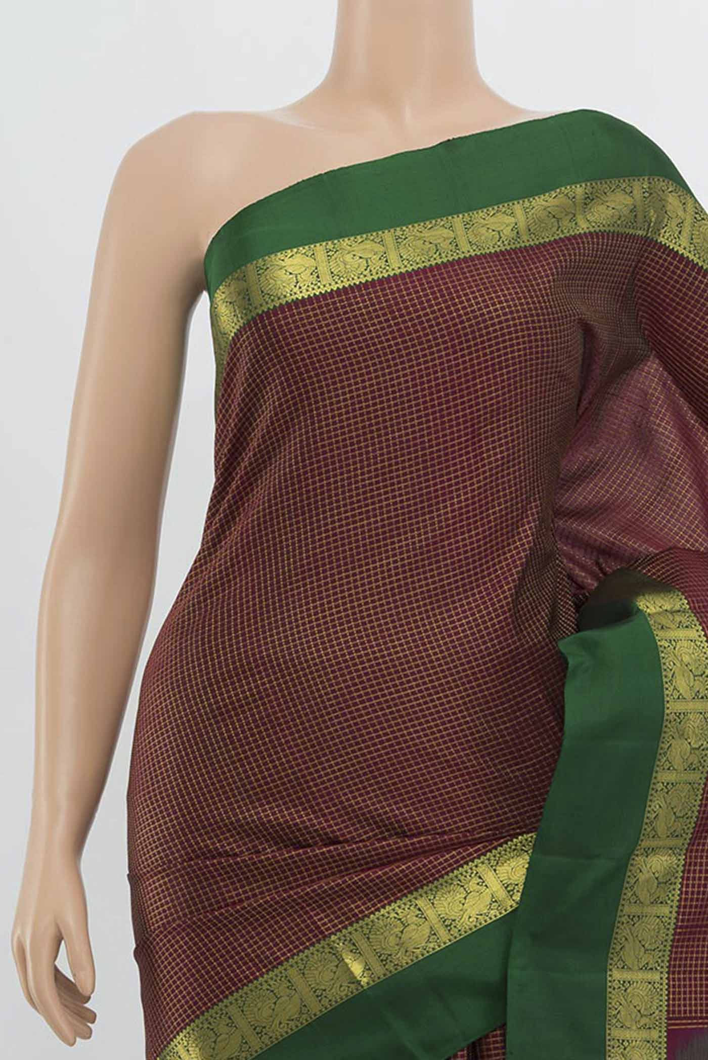 Border image of Maroon Kanchipuram Silk Saree with Zari Butta on the body and Silk Border. 