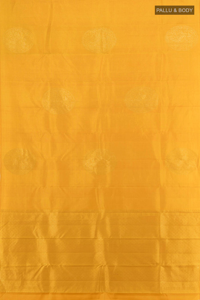 Flat view of Yellow Kanjivaram Silk Saree with Zari Butta on the body and Silk Border. 
