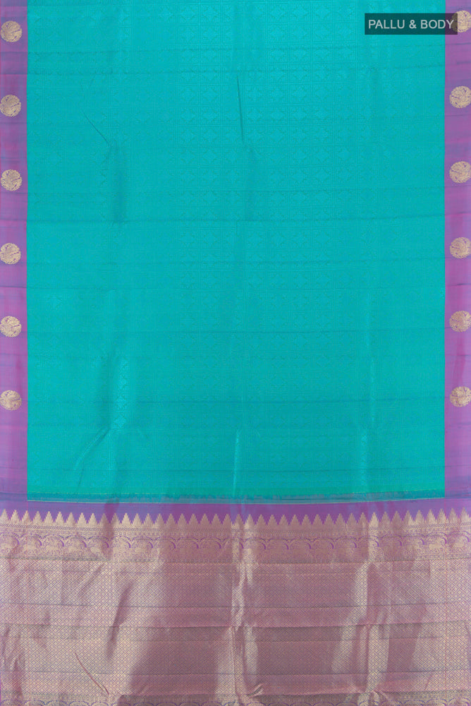 Flat view of Pure Silk Pure Zari Light Blue Kanjivaram Saree with Zari Butta on the body and Silk Border. 