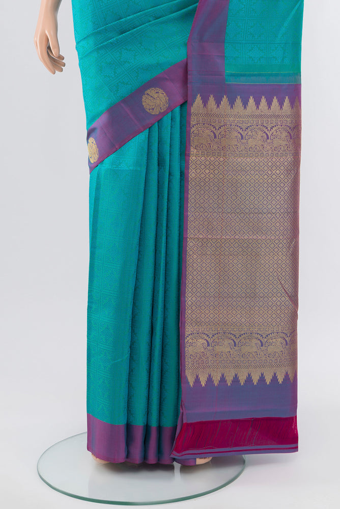 Pleats and pallu of Pure Silk Pure Zari Light Blue Kanjivaram Saree with Zari Butta on the body and Silk Border. 