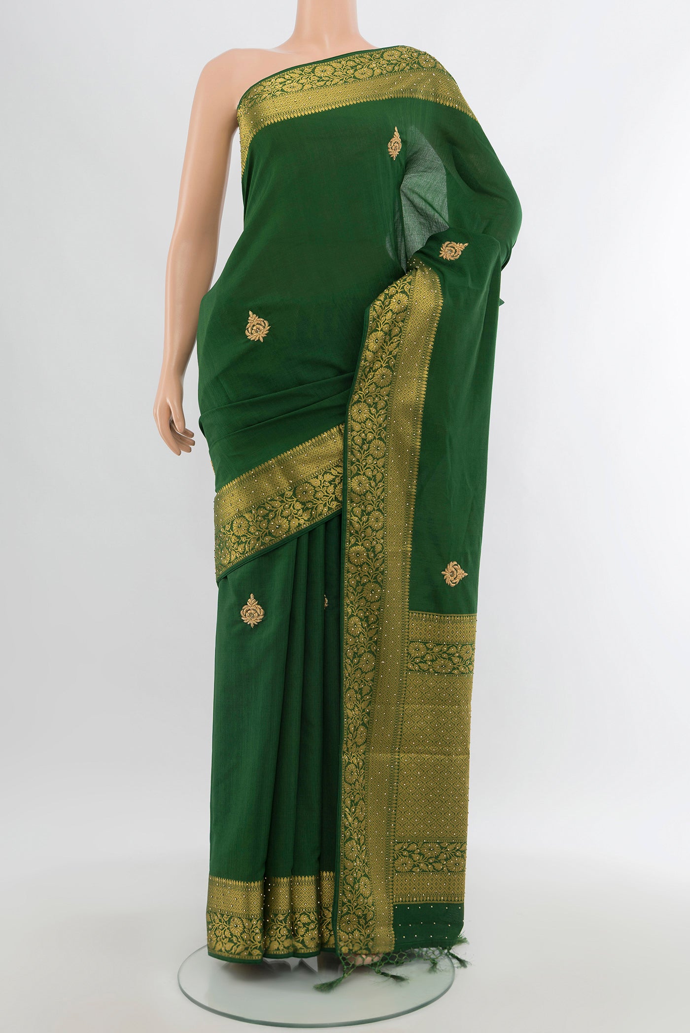 Bottle Green Blended Art Silk Saree with Embroidery on the body and Zari Border.  displayed on a mannequin