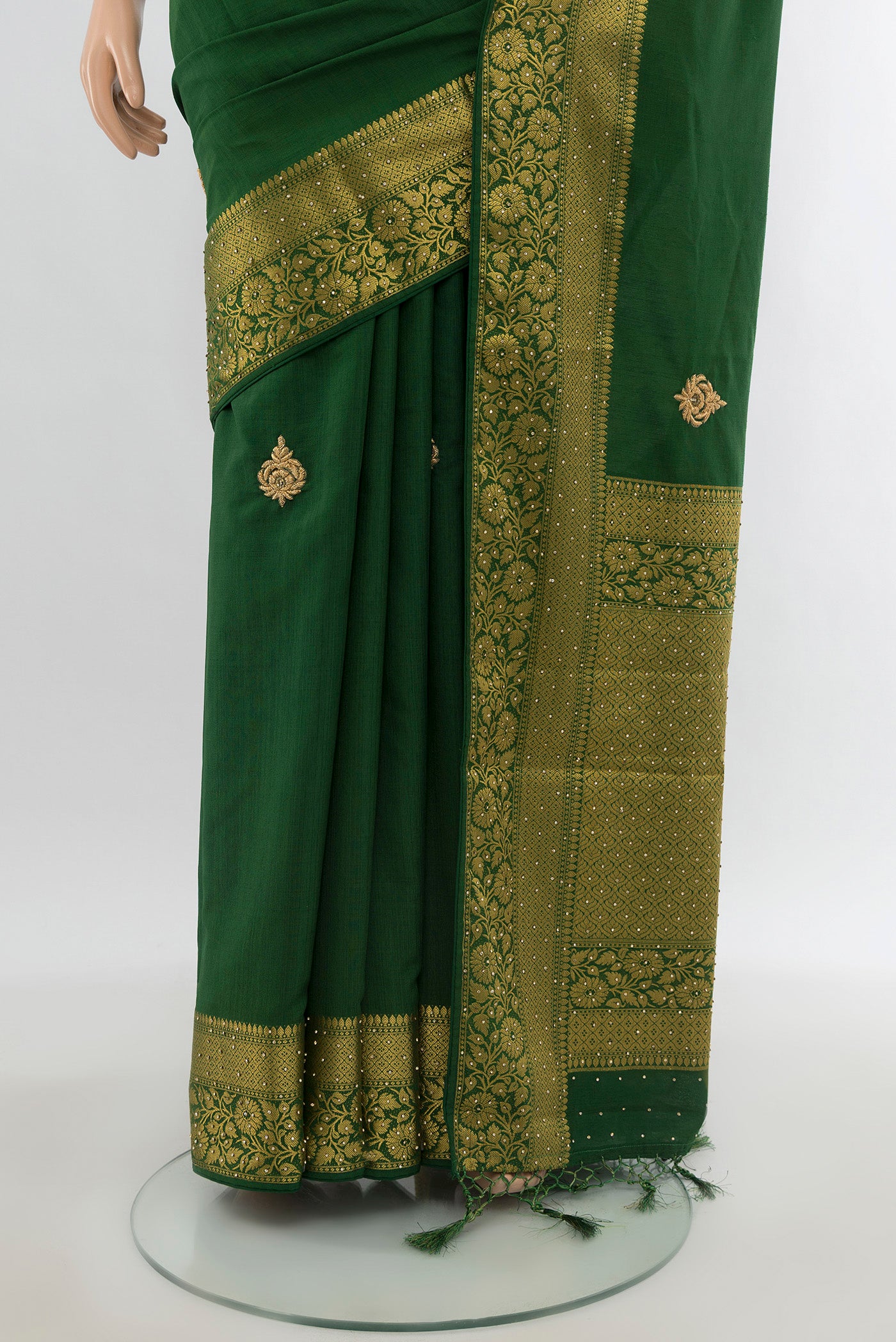 Pleats and pallu of Bottle Green Blended Art Silk Saree with Embroidery on the body and Zari Border. 