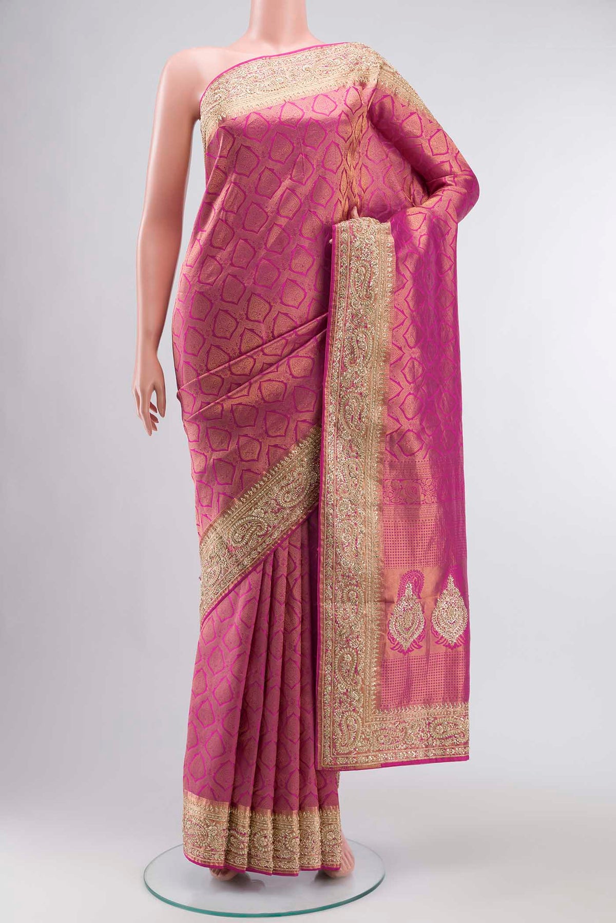 Pink Kanchipuram Silk Saree with Zari Brocade on the body and Embroidery Border displayed on a mannequin