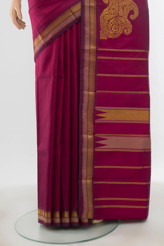 Pleats and pallu of Pure Silk Pure Zari Purple Kanchipuram Saree with Zari Butta on the body and Silk Border. 