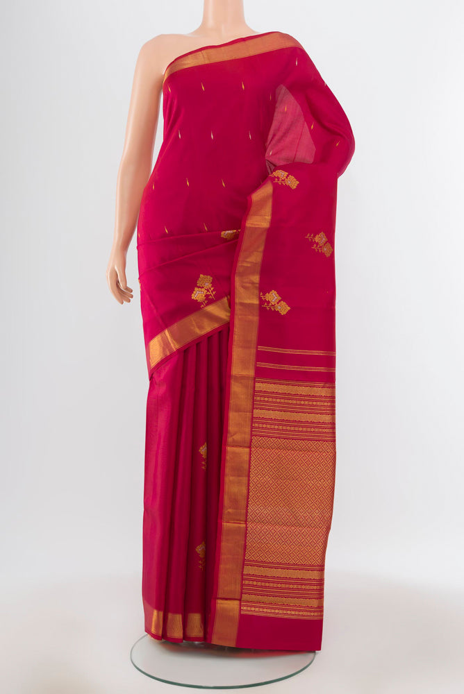 Pure Silk Pure Zari Maroon Kanjivaram Saree with Zari Butta on the body and Silk Border.  displayed on a mannequin