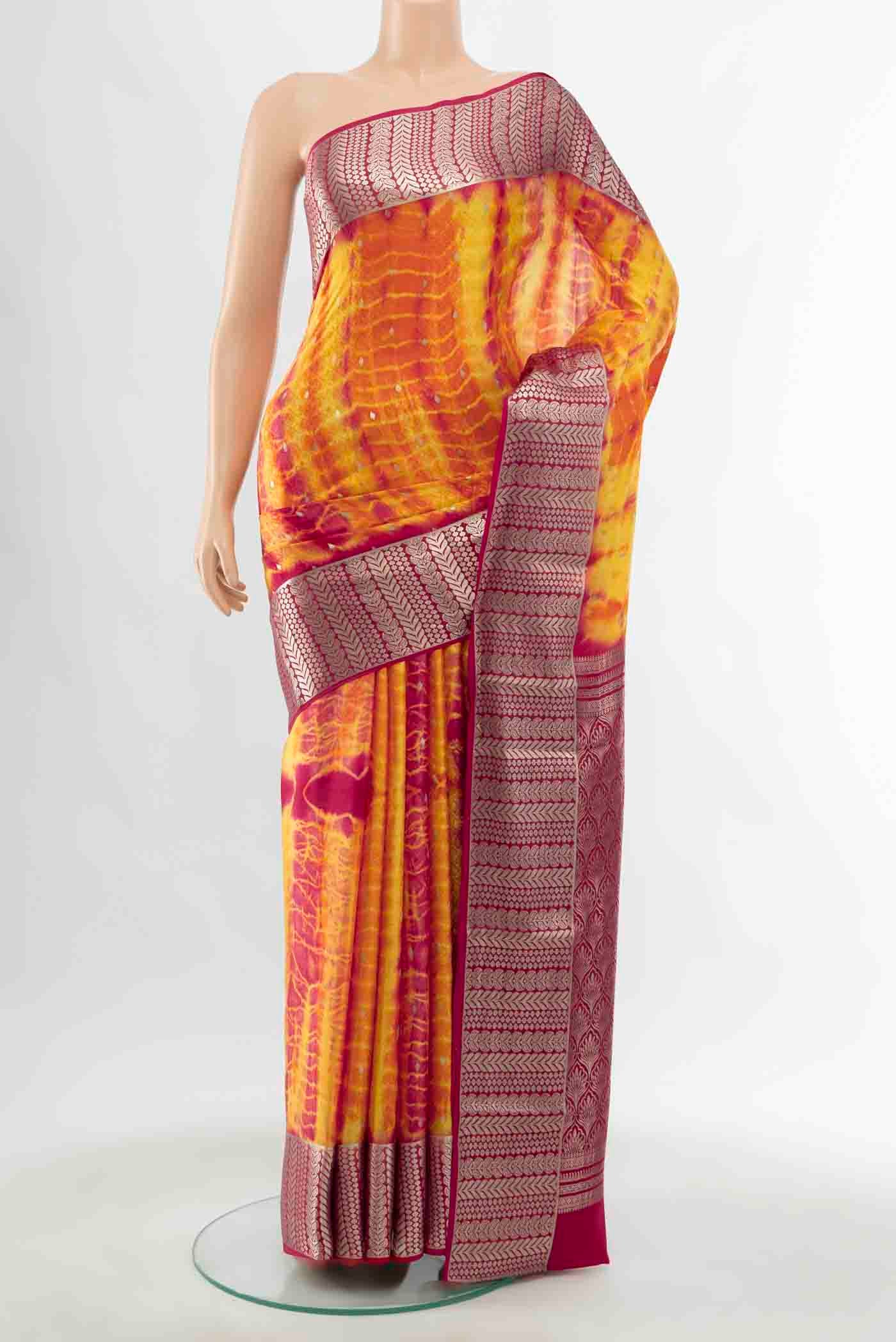Multi Color Mysore Crepe Saree with Zari Butta on the body and Zari Border displayed on a mannequin