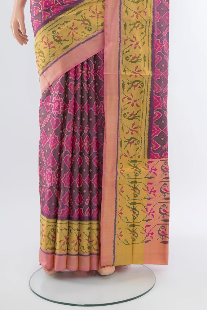 Pleats and pallu of Multi Color Rajkot Patola Silk Saree with Ikat Print on the body and Silk Border. 