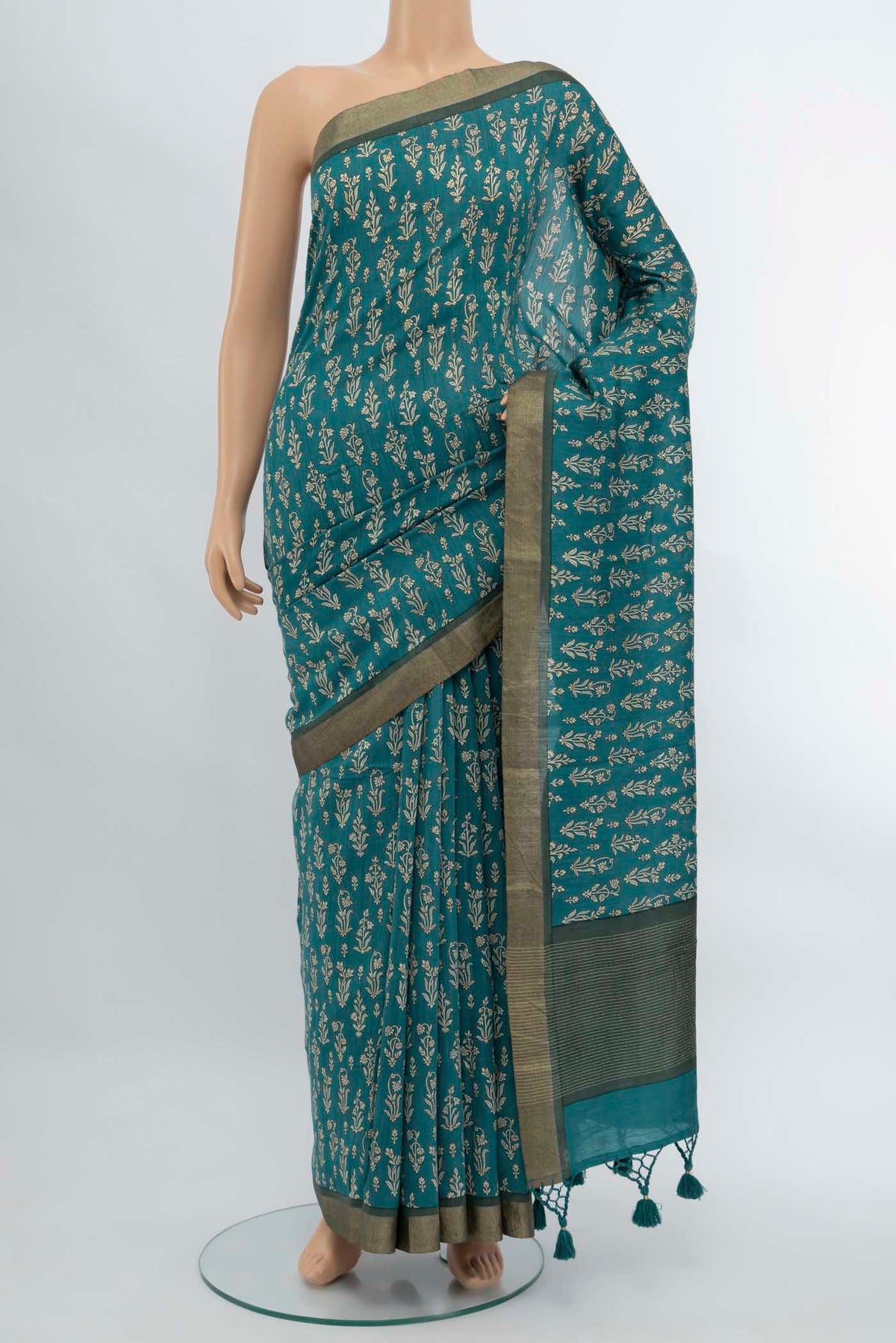 Blue Tussar Saree with Printed design on the body and Fancy Border displayed on a mannequin