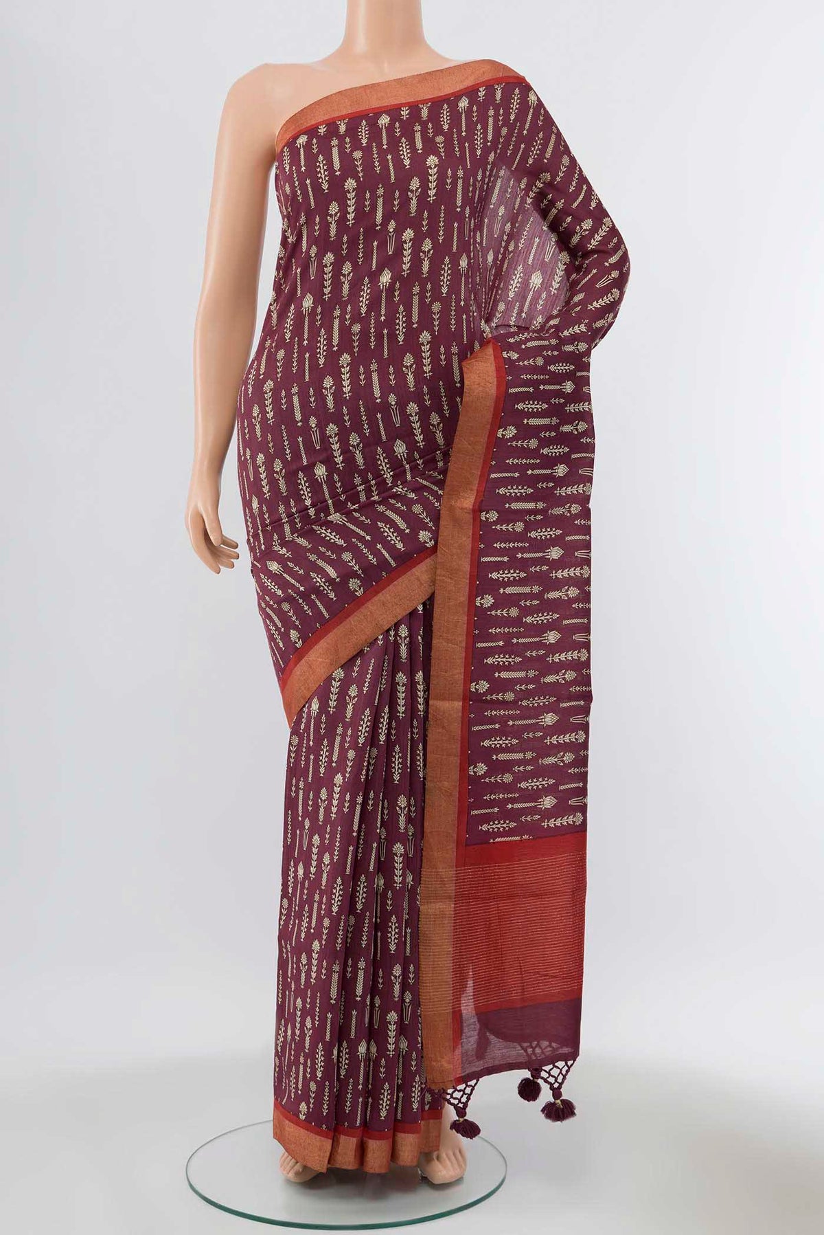 Coffee Brown Tussar Silk Saree with Zari Butta on the body and Fancy Border displayed on a mannequin