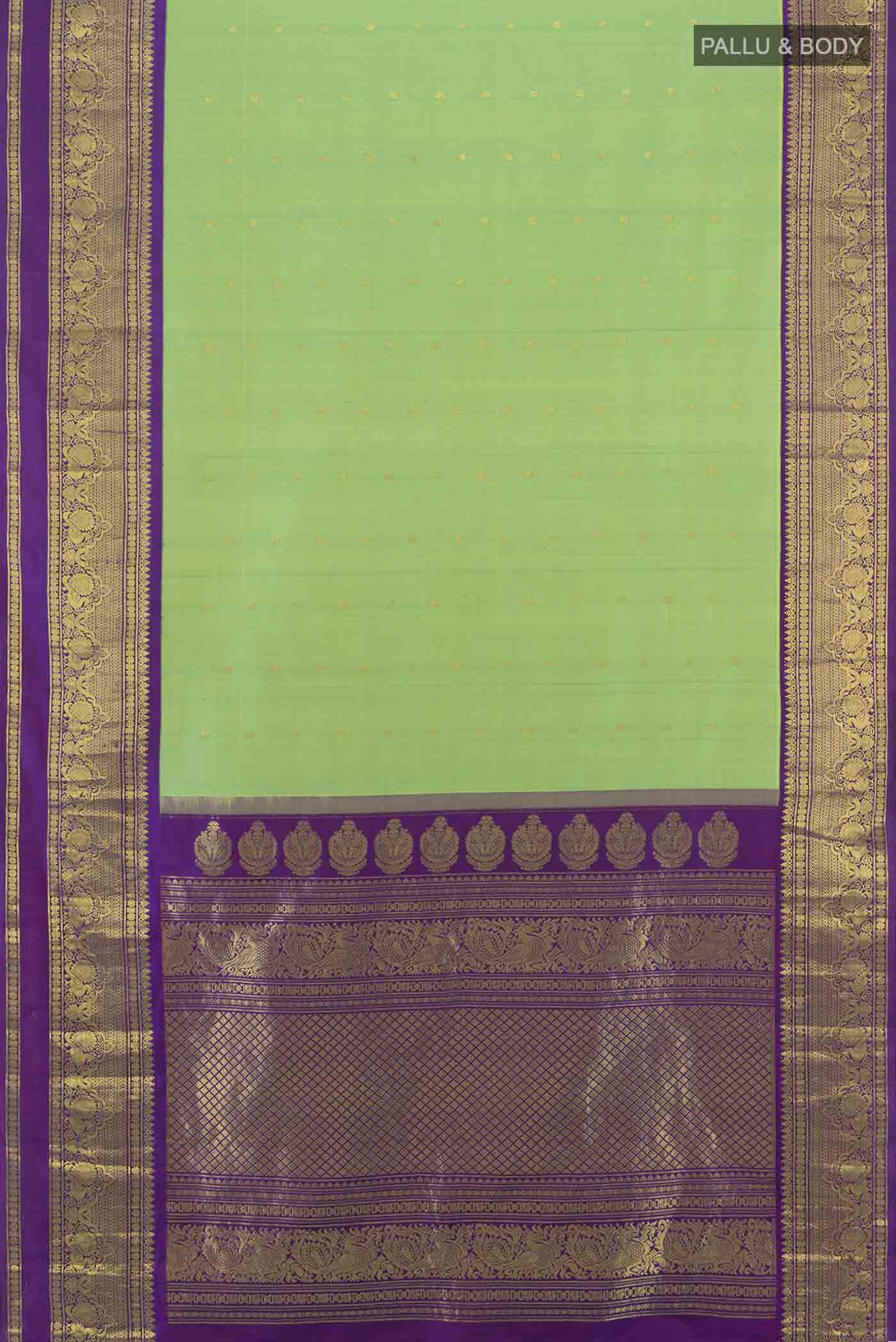Flat view of Parrot Green Gadwal Silk Saree with Zari Butta on the body and Silk Border. 