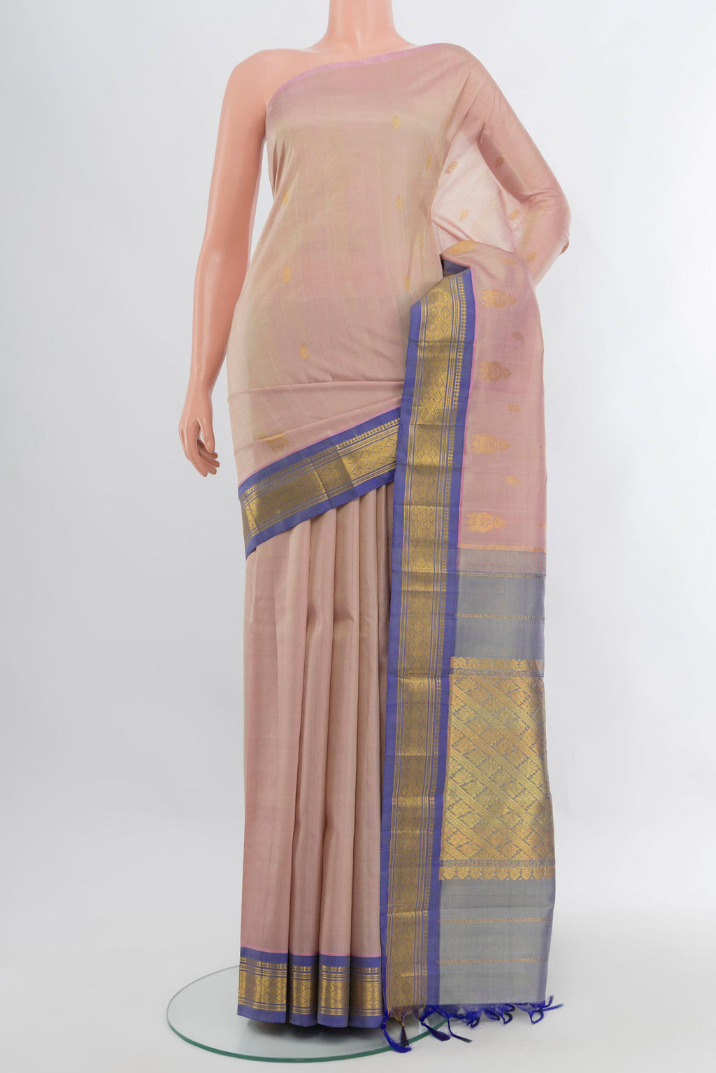 Rose pink Kanchipuram Silk Saree with Zari Butta on the body and One Side Border.  displayed on a mannequin