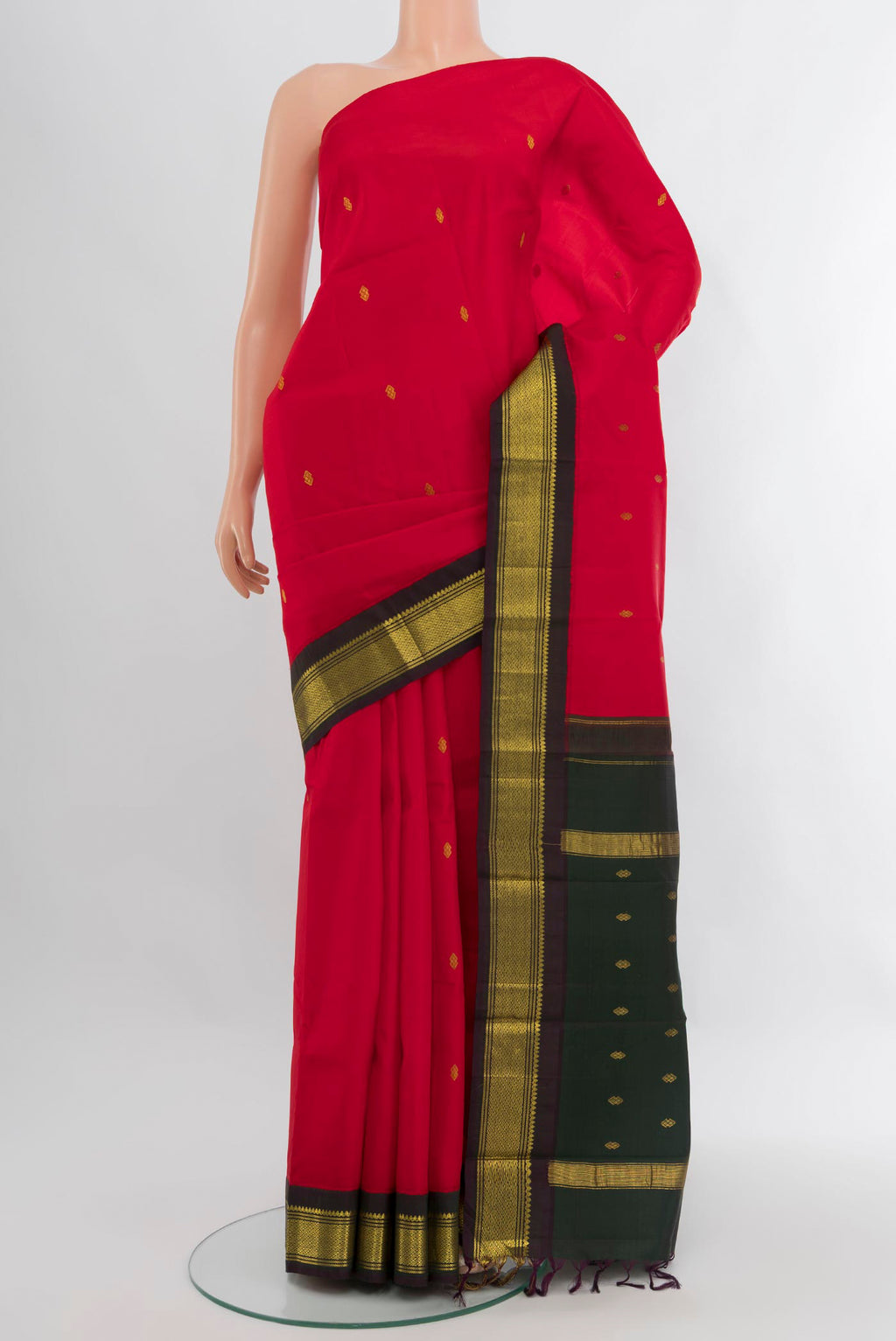 Red Kanchipuram Silk Saree with Zari Butta on the body and One Side Border.  displayed on a mannequin