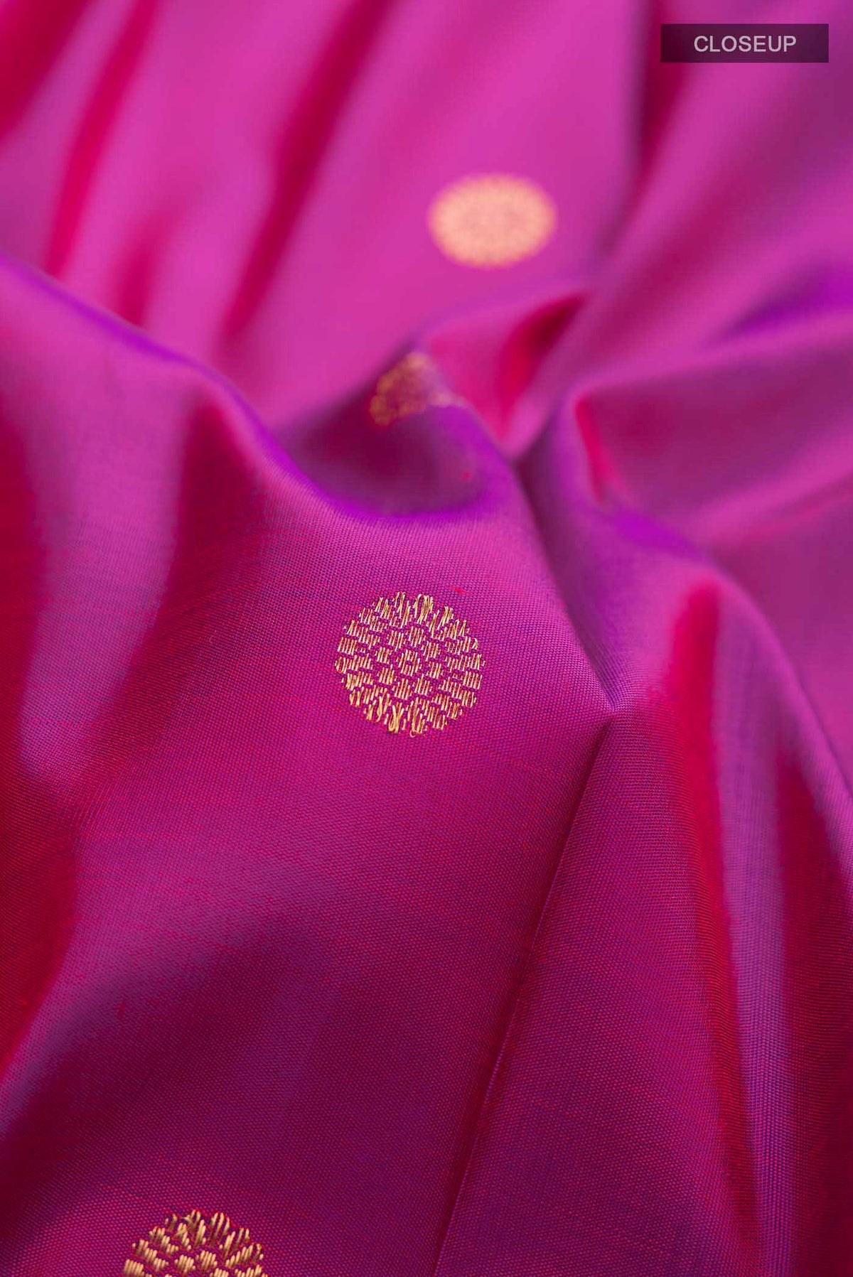 Close up of Pure Silk Pure Zari Magenta Gadwal Saree with Zari Butta on the body and Paithani Border displaying folds