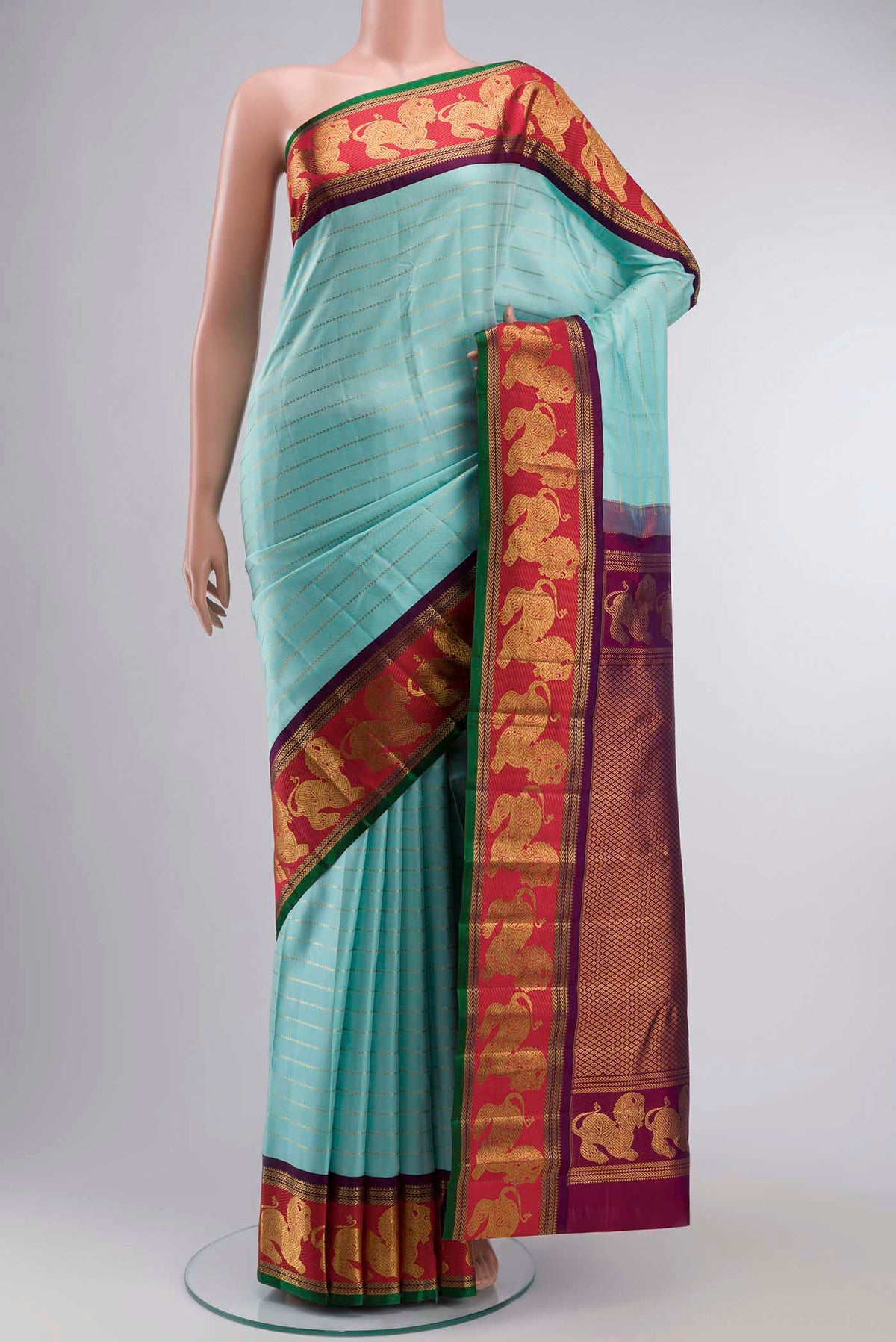 Pure Silk Pure Zari Turquoise Kanchipuram Saree with Zari Butta on the body and Zari Border displayed on a mannequin
