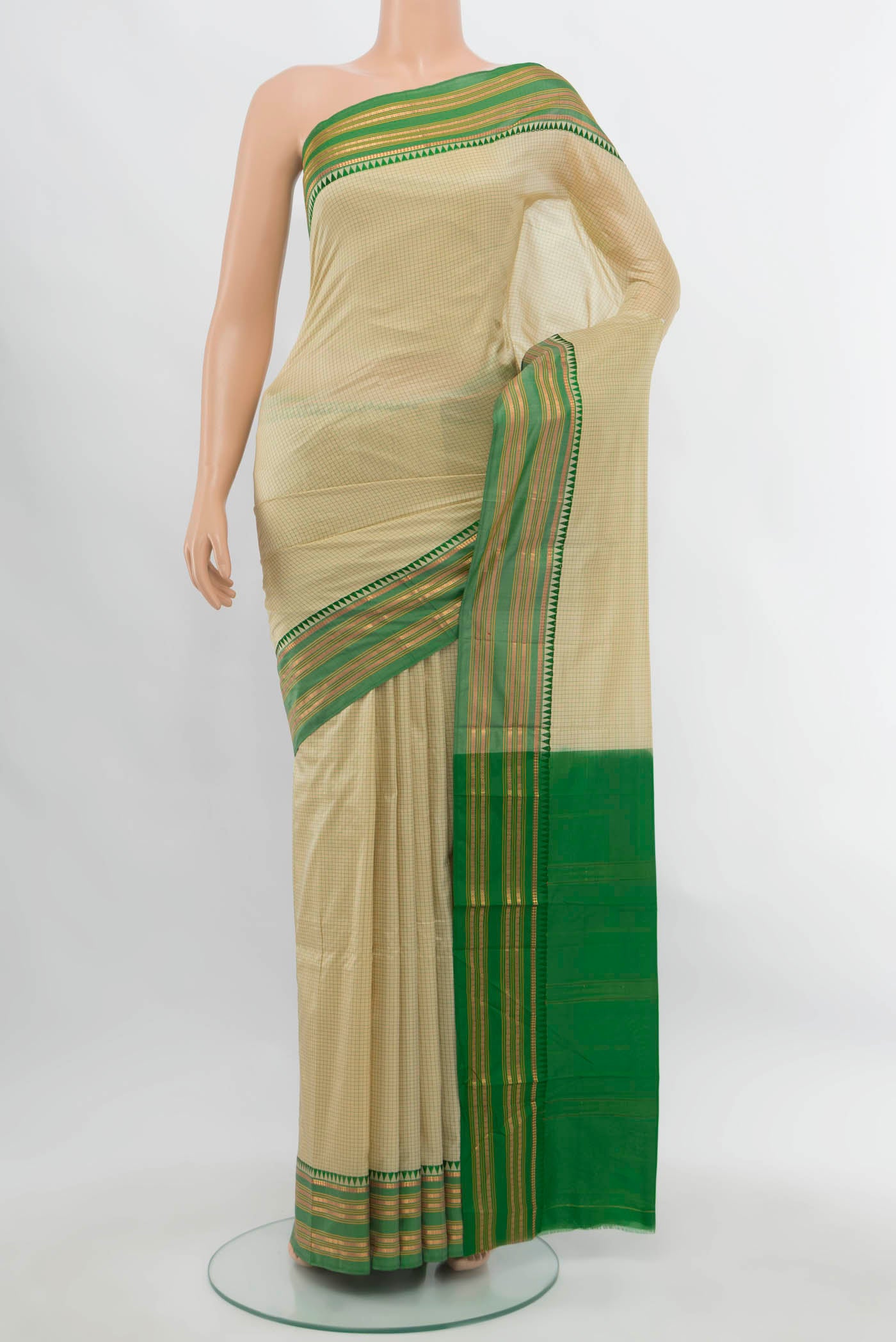 Cream Narayanpet Silk Saree with Zari Butta on the body and Silk Border.  displayed on a mannequin