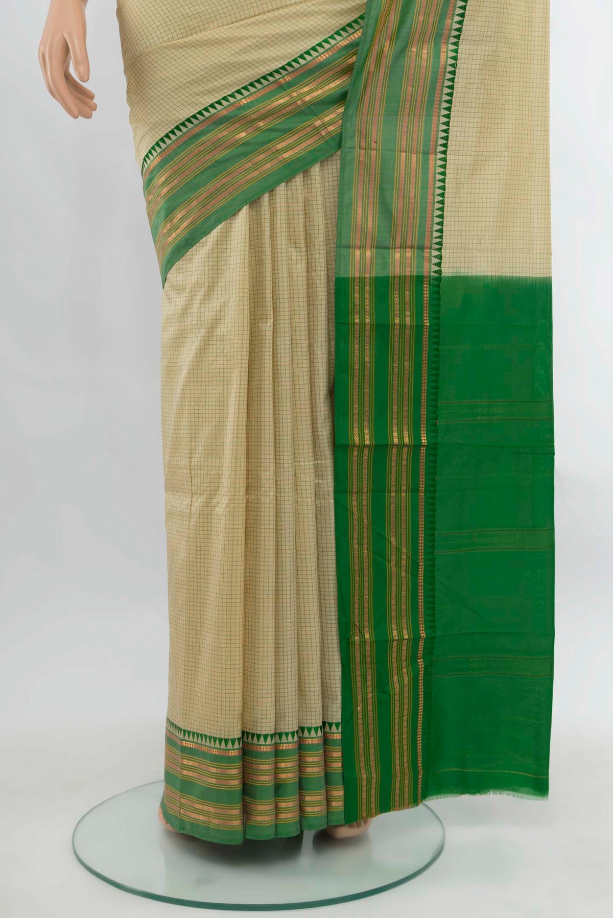 Pleats and pallu of Cream Narayanpet Silk Saree with Zari Butta on the body and Silk Border. 