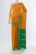 Mustard Narayanpet Silk Saree with Plain Body and Silk Border.  displayed on a mannequin