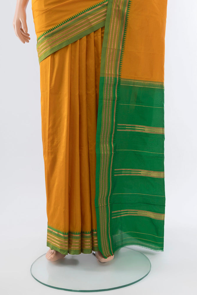 Pleats and pallu of Mustard Narayanpet Silk Saree with Plain Body and Silk Border. 