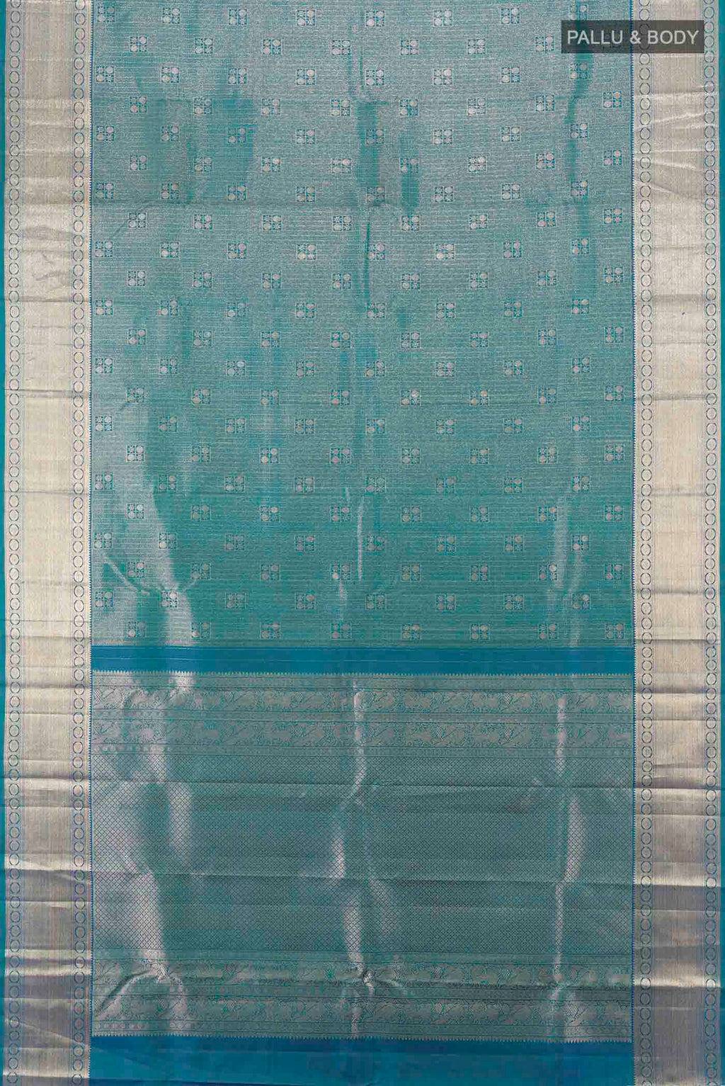 Flat view of Peacock Blue Kanchipuram Silk Saree with Zari Butta on the body and Silk Border. 