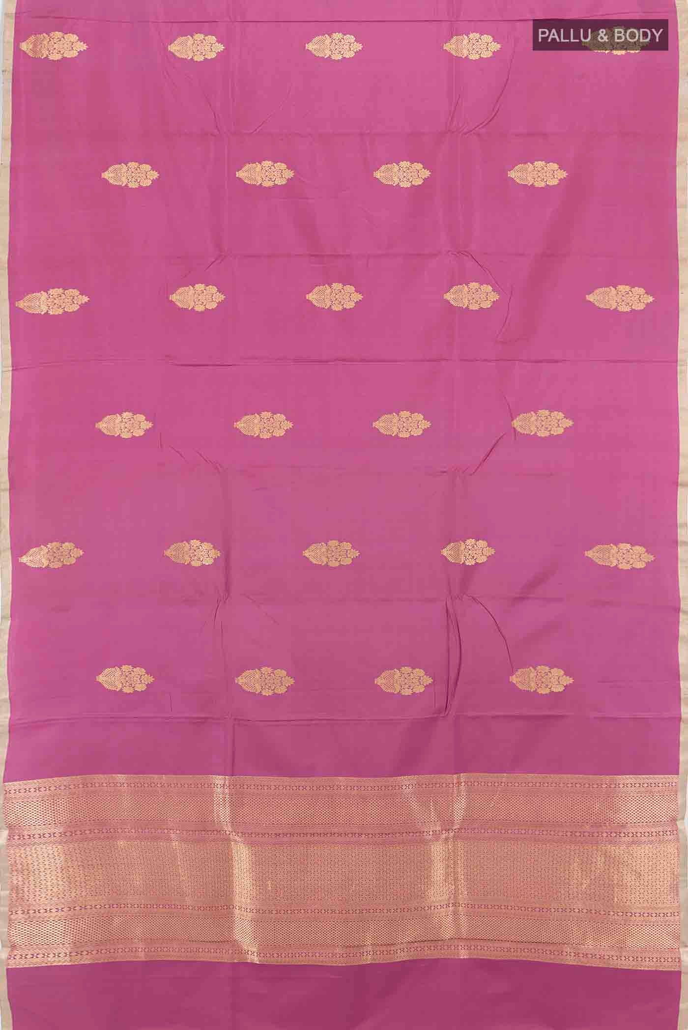 Flat view of Light Magenta Banarasi Katan Silk Saree with Zari Butta on the body and Silk Border. 