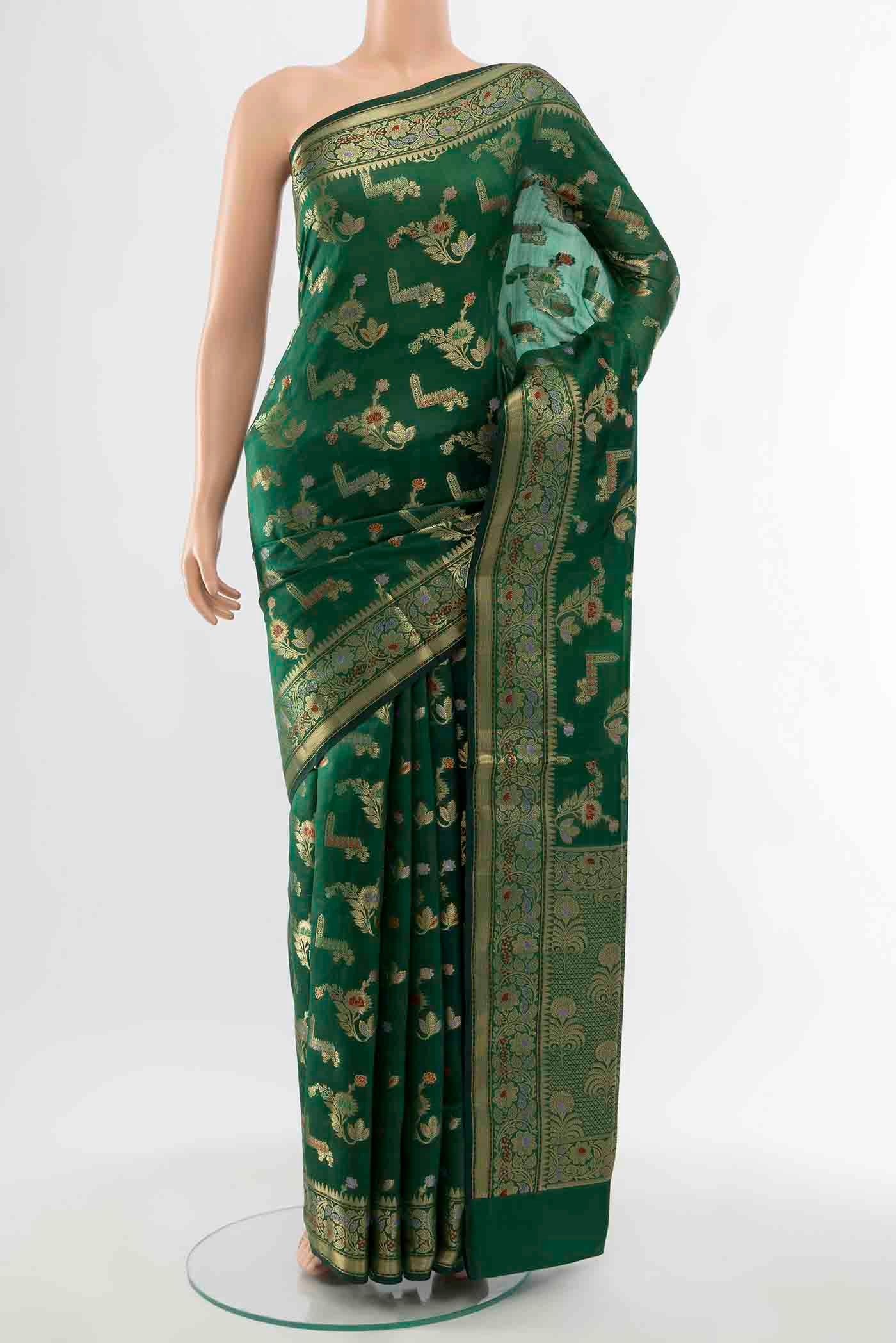 Bottle Green Banarasi Raw Silk Saree with Zari Butta on the body and Silk Border displayed on a mannequin