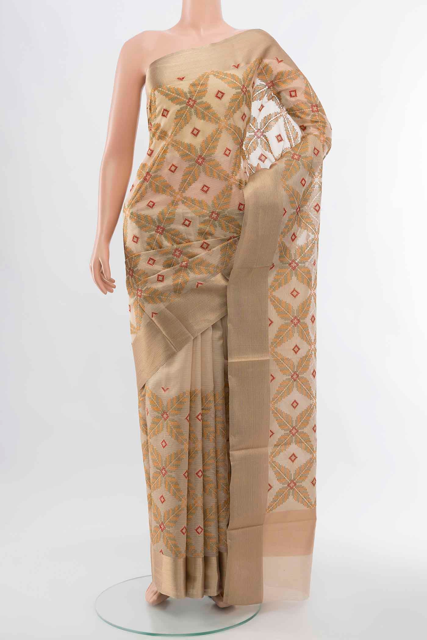 Beige Art Silk Saree with Embroidery on the body and Silk Border displayed on a mannequin