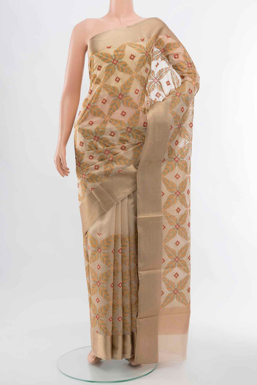 Beige Art Silk Saree with Embroidery on the body and Silk Border displayed on a mannequin