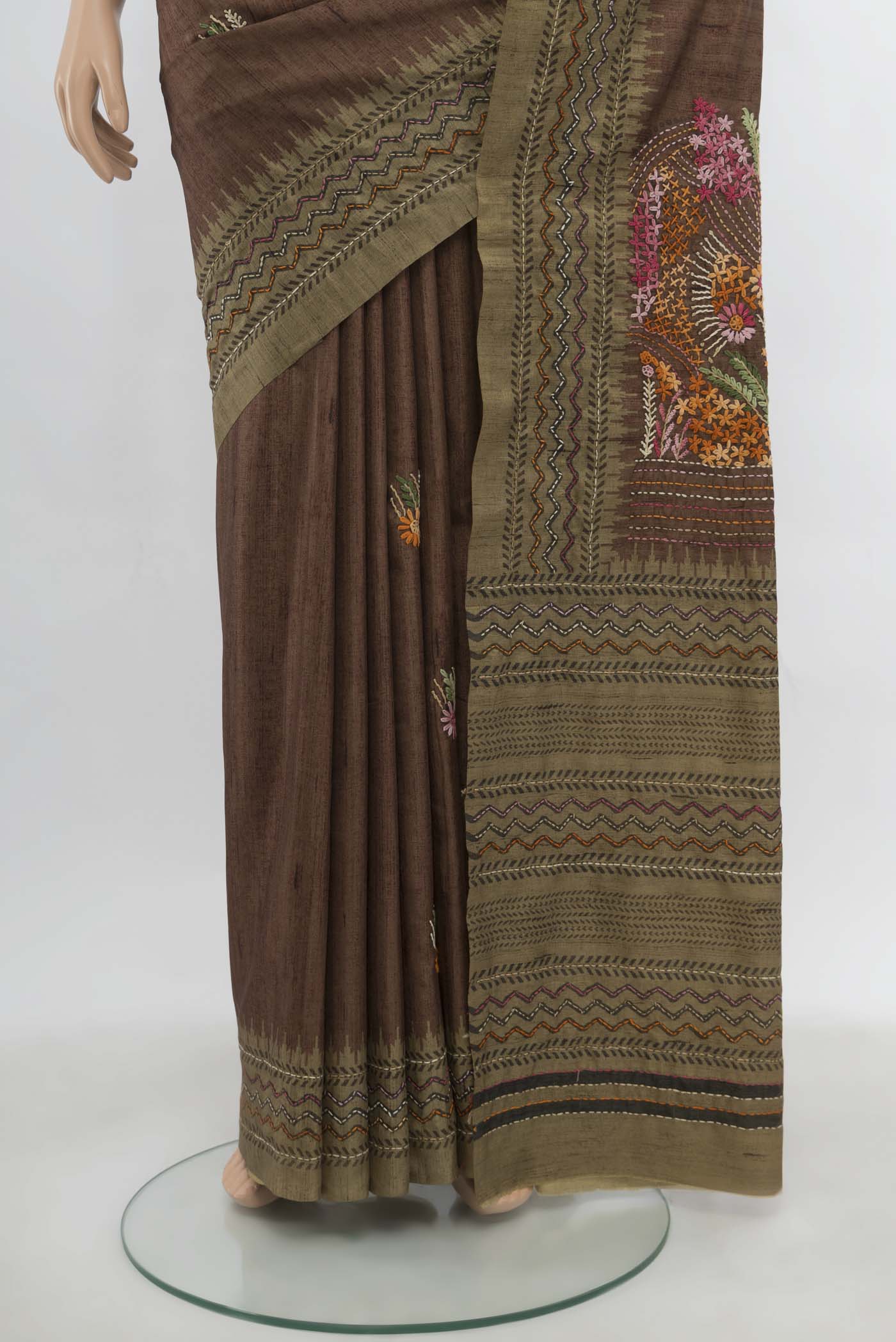Pleats and pallu of Brown Art Silk Saree with Embroidery on the body and Embroidery Border. 