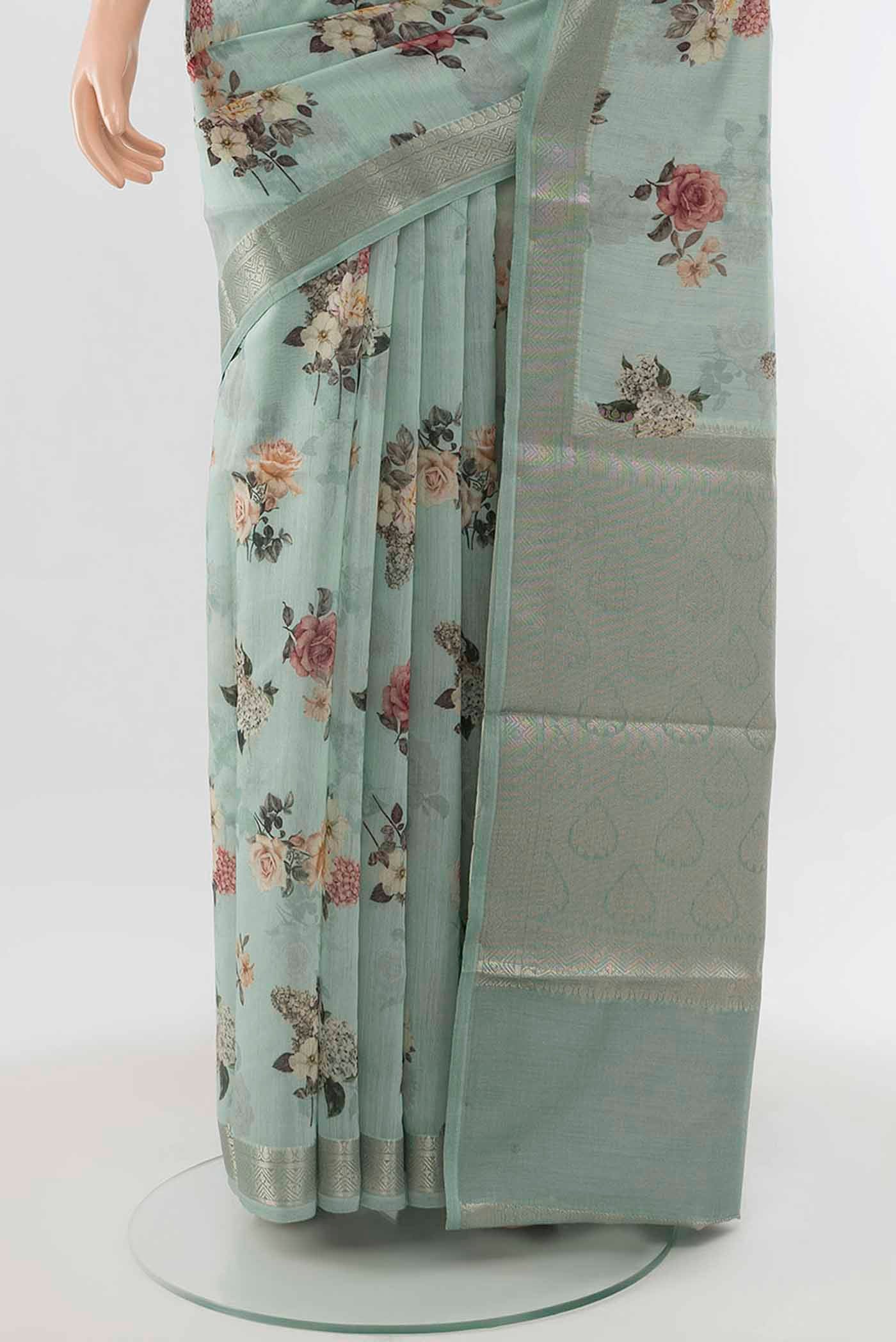 Pleats and pallu of Light Green Tussar Silk Saree with Floral Print on the body and Silk Border