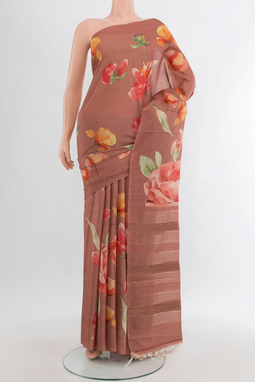 Rust Tussar Silk Saree with Floral Print on the body and Without Border.  displayed on a mannequin