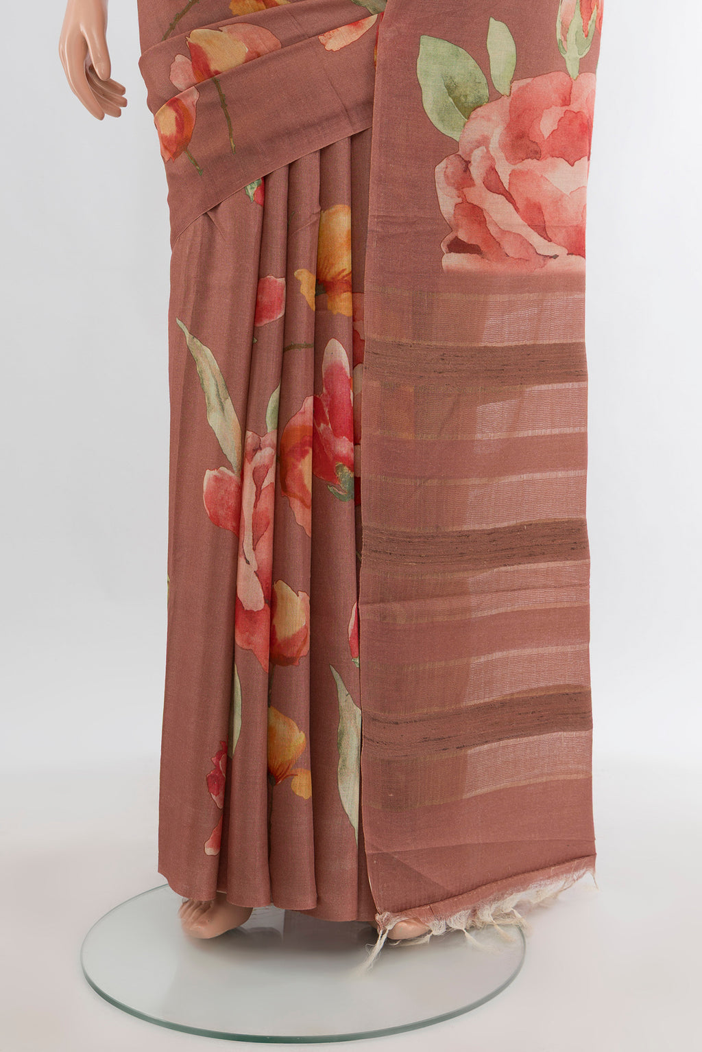 Pleats and pallu of Rust Tussar Silk Saree with Floral Print on the body and Without Border. 