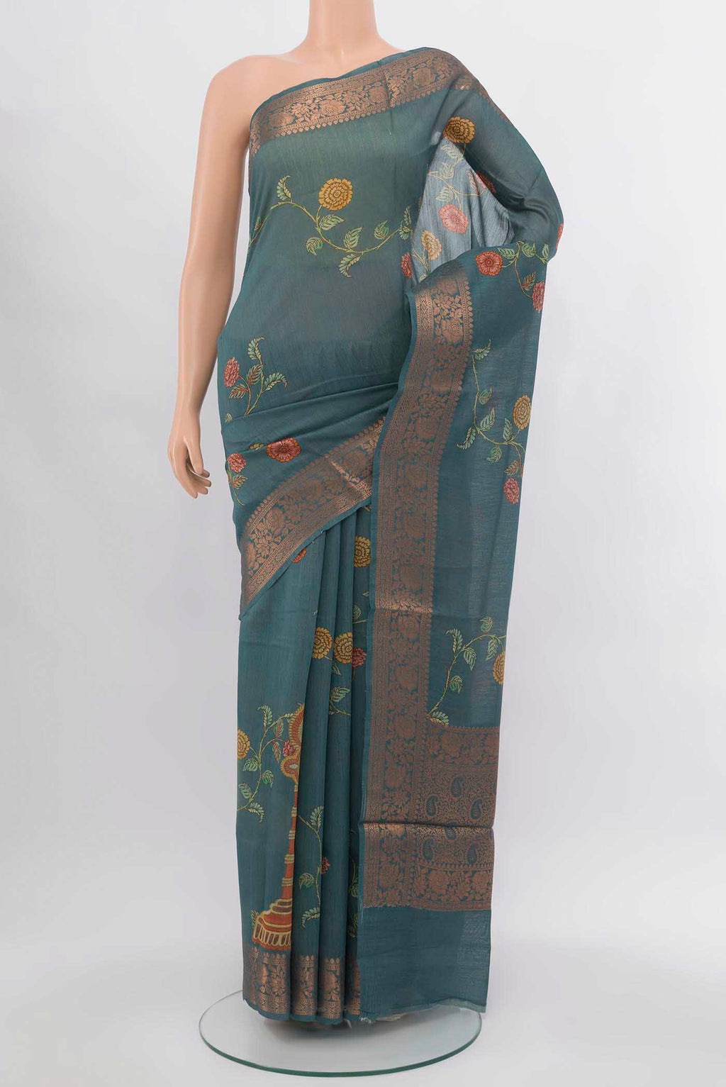 Grey Tussar Silk Saree with Zari Butta on the body and Silk Border.  displayed on a mannequin