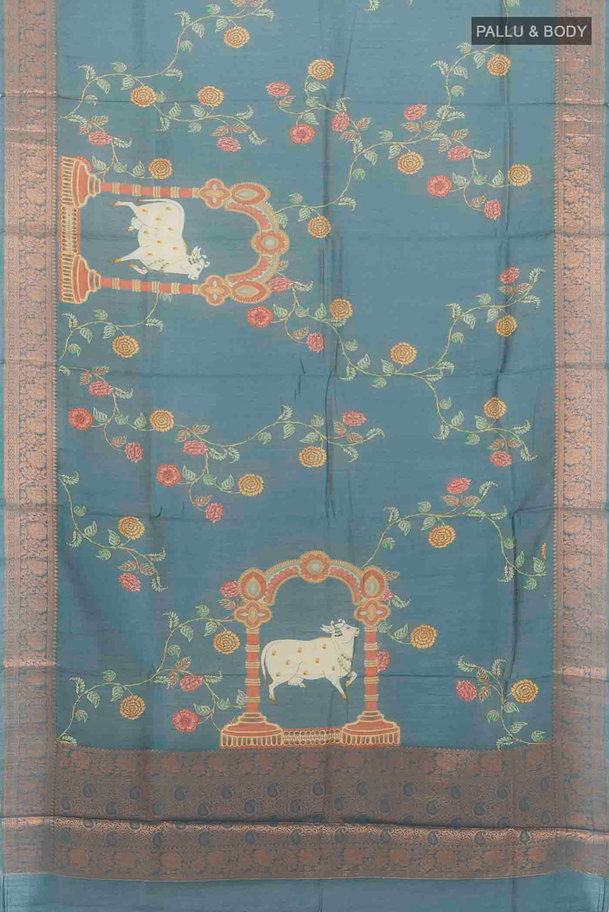 Flat view of Grey Tussar Silk Saree with Zari Butta on the body and Silk Border. 