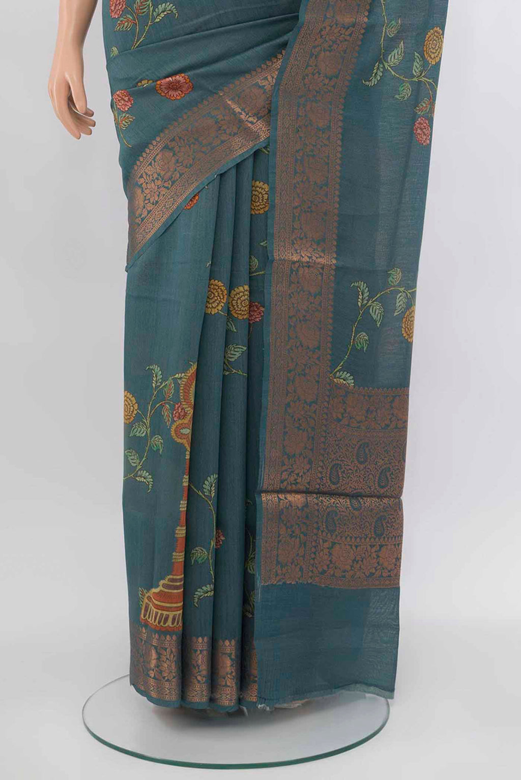 Pleats and pallu of Grey Tussar Silk Saree with Zari Butta on the body and Silk Border. 