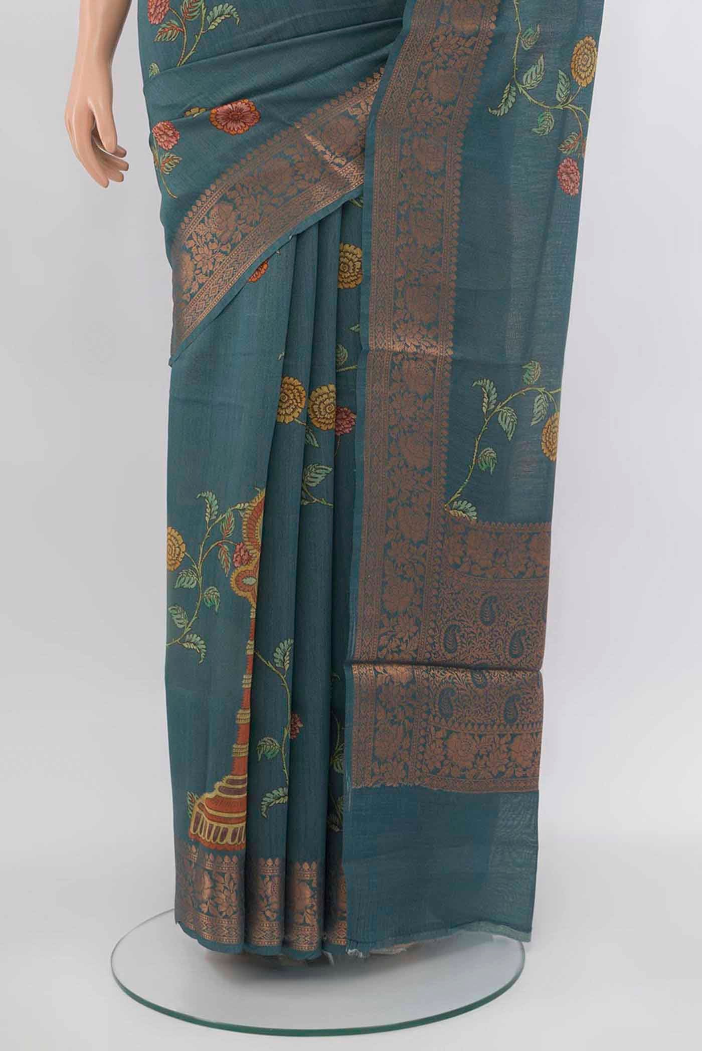 Pleats and pallu of Grey Tussar Silk Saree with Zari Butta on the body and Silk Border. 