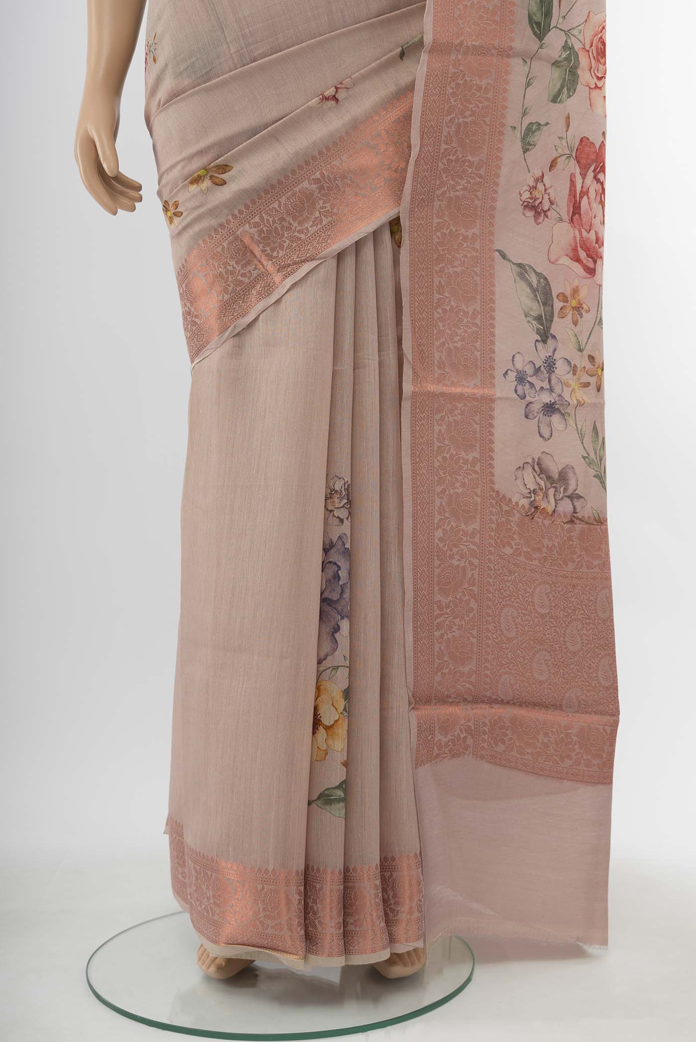 Pleats and pallu of Beige Tussar Silk Saree with Zari Butta on the body and Silk Border