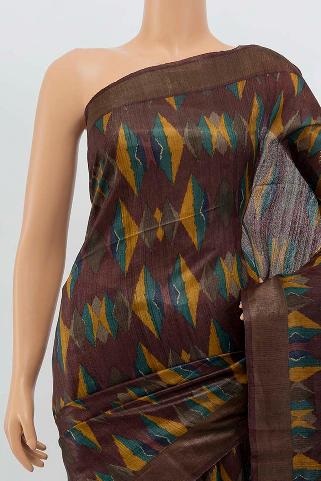 Border image of Brown Tussar Silk Saree with Zari Butta on the body and Silk Border