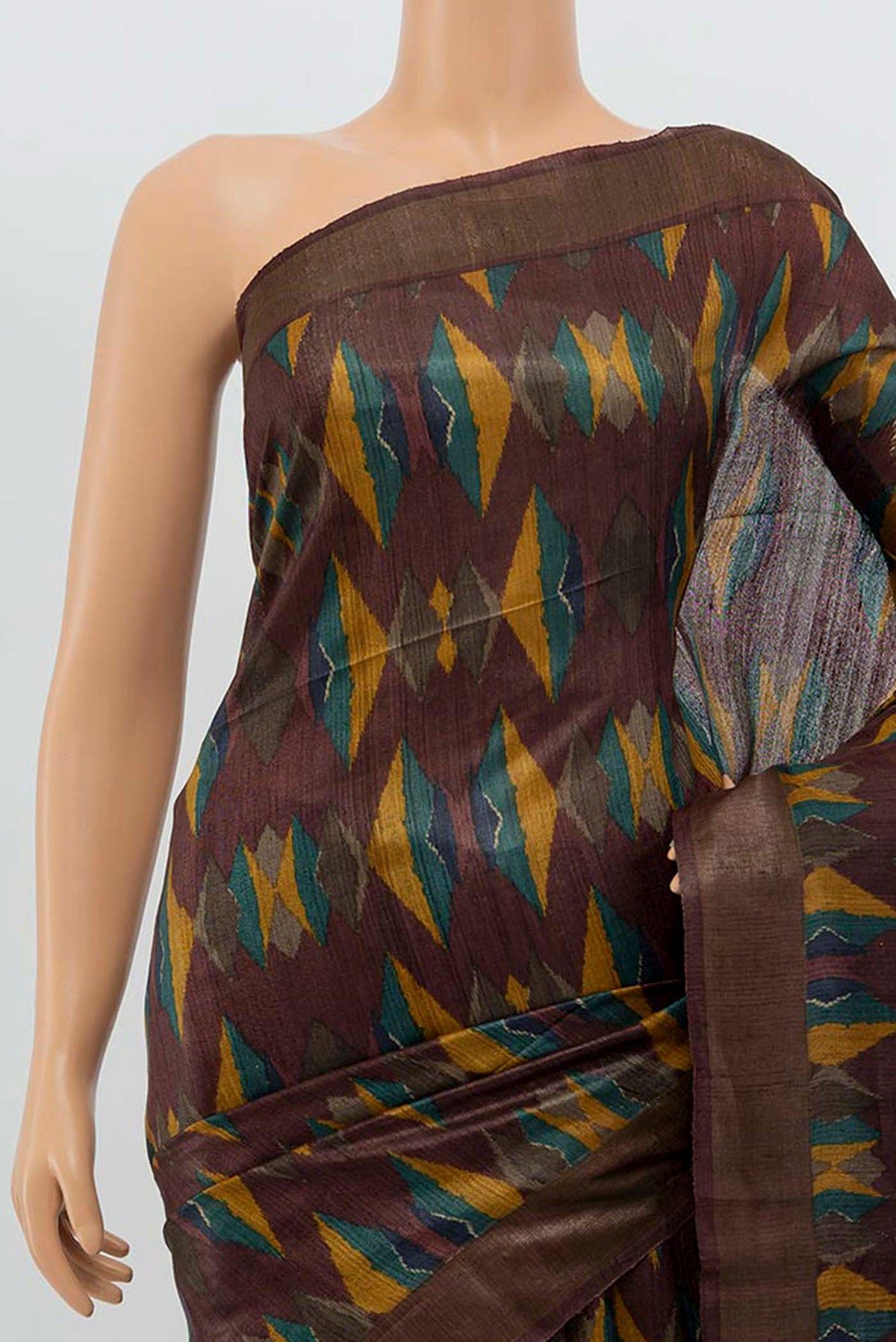 Border image of Brown Tussar Silk Saree with Zari Butta on the body and Silk Border