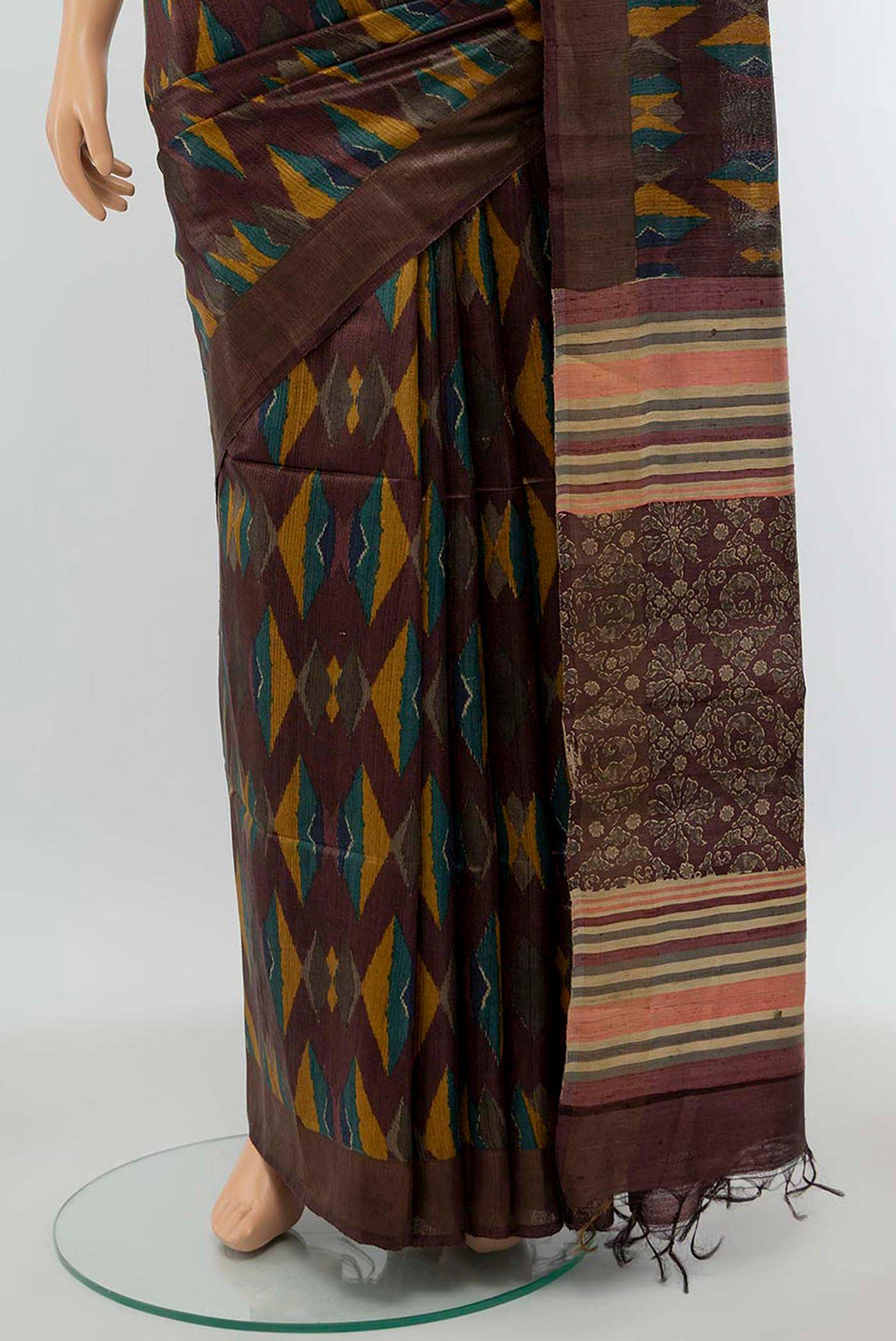 Pleats and pallu of Brown Tussar Silk Saree with Zari Butta on the body and Silk Border