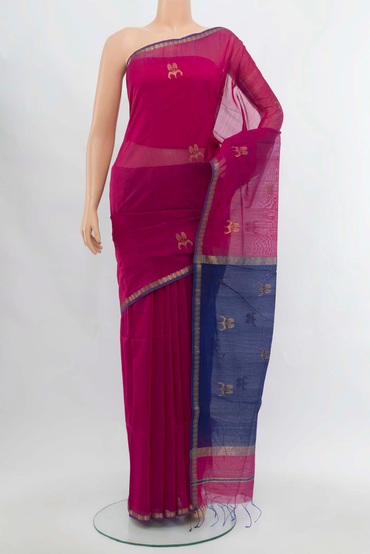 Navy Blue Maheshwari Silk Cotton Saree with Zari Butta on the body and Silk Border.  displayed on a mannequin