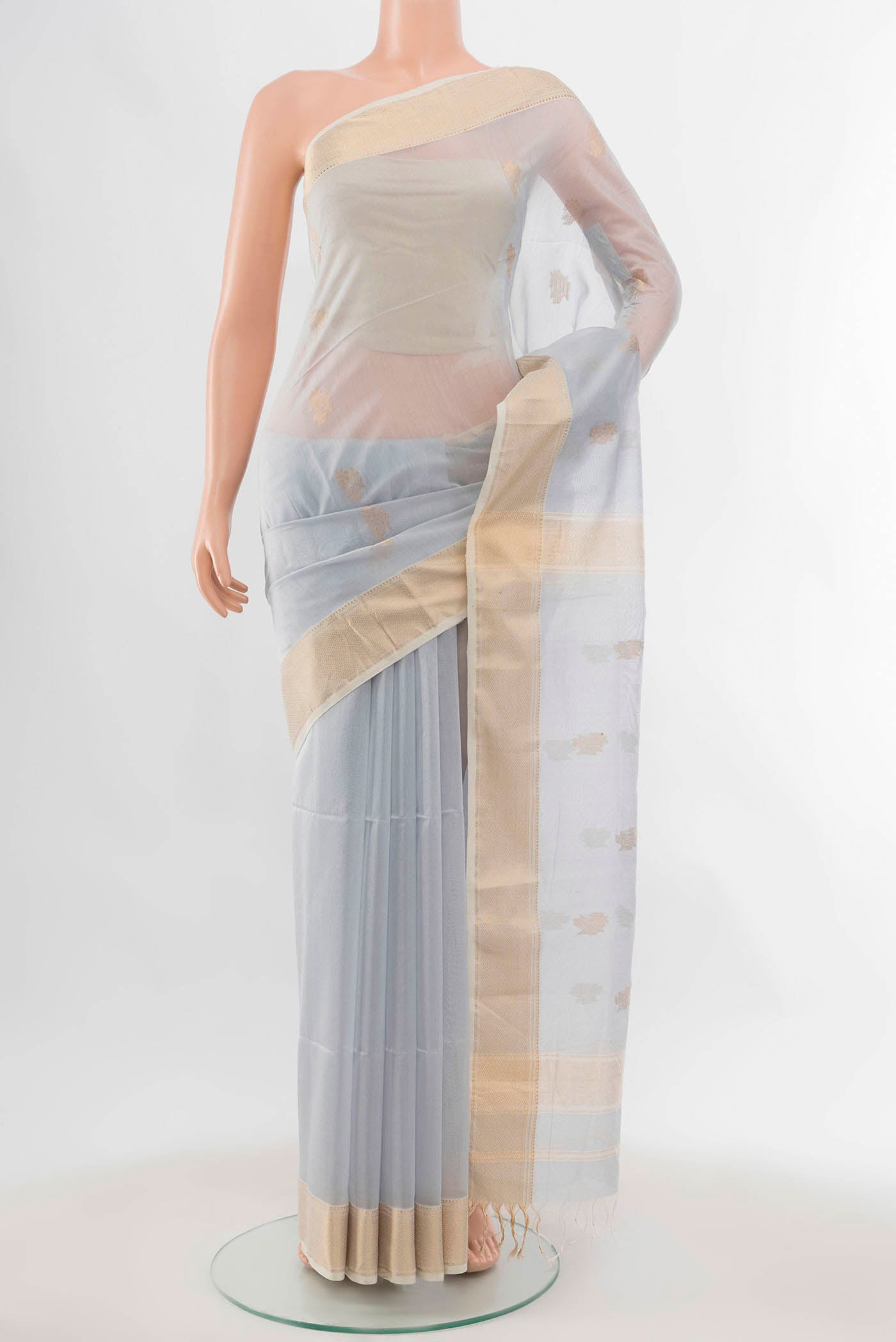 Grey Maheshwari Silk Cotton Saree with Zari Butta on the body and Silk Border displayed on a mannequin