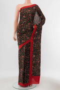 Black Printed Silk Saree with Thread Butta on the body and Silk Border displayed on a mannequin