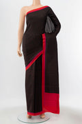 Black Printed Silk Saree with Printed design on the body and Silk Border displayed on a mannequin
