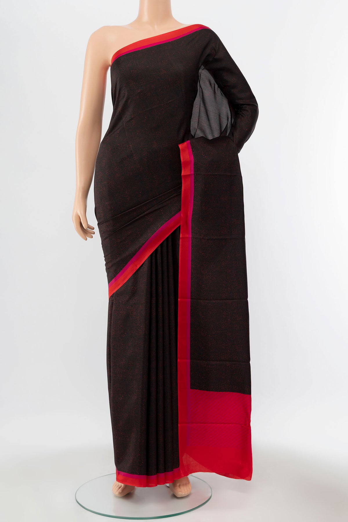 Black Printed Silk Saree with Printed design on the body and Silk Border displayed on a mannequin