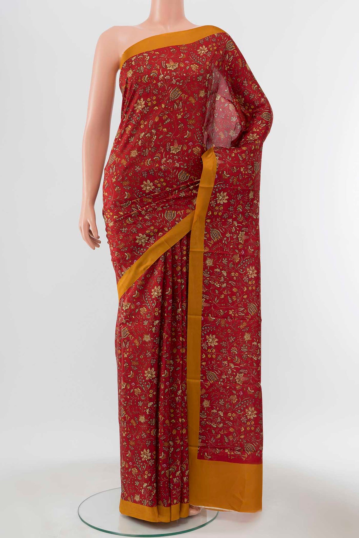 Maroon Printed Silk Saree with Printed design on the body and Plain Border displayed on a mannequin