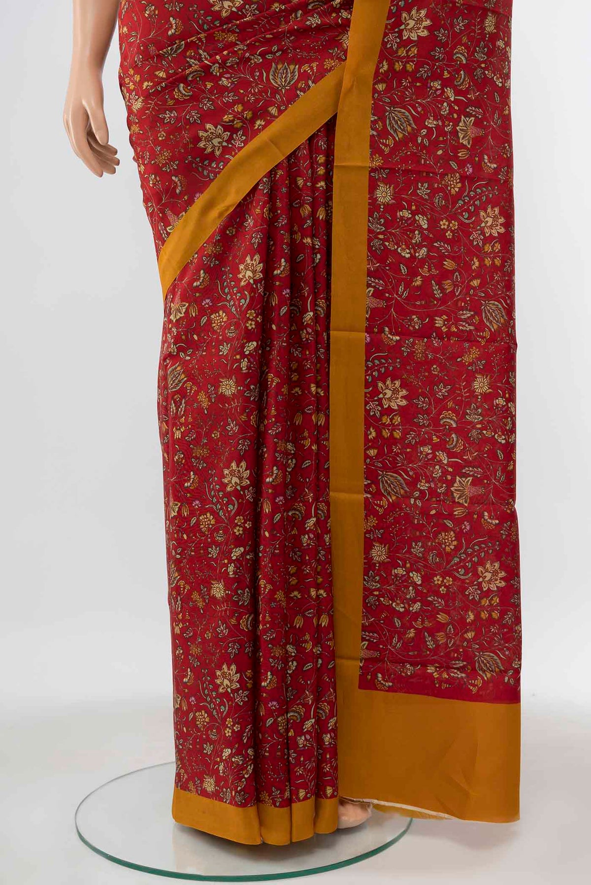 Pleats and pallu of Maroon Printed Silk Saree with Printed design on the body and Plain Border
