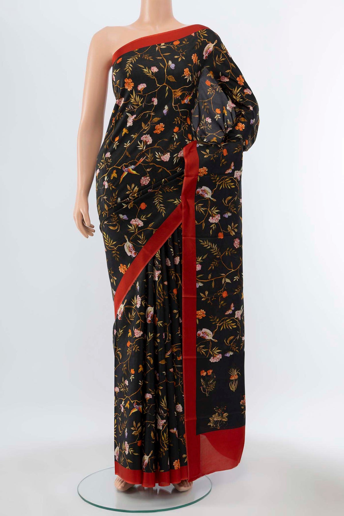 Black Printed Silk Saree with Floral Print on the body and Silk Border displayed on a mannequin