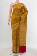 Mustard Banarasi Raw Silk Saree with Zari Brocade on the body and Silk Border displayed on a mannequin