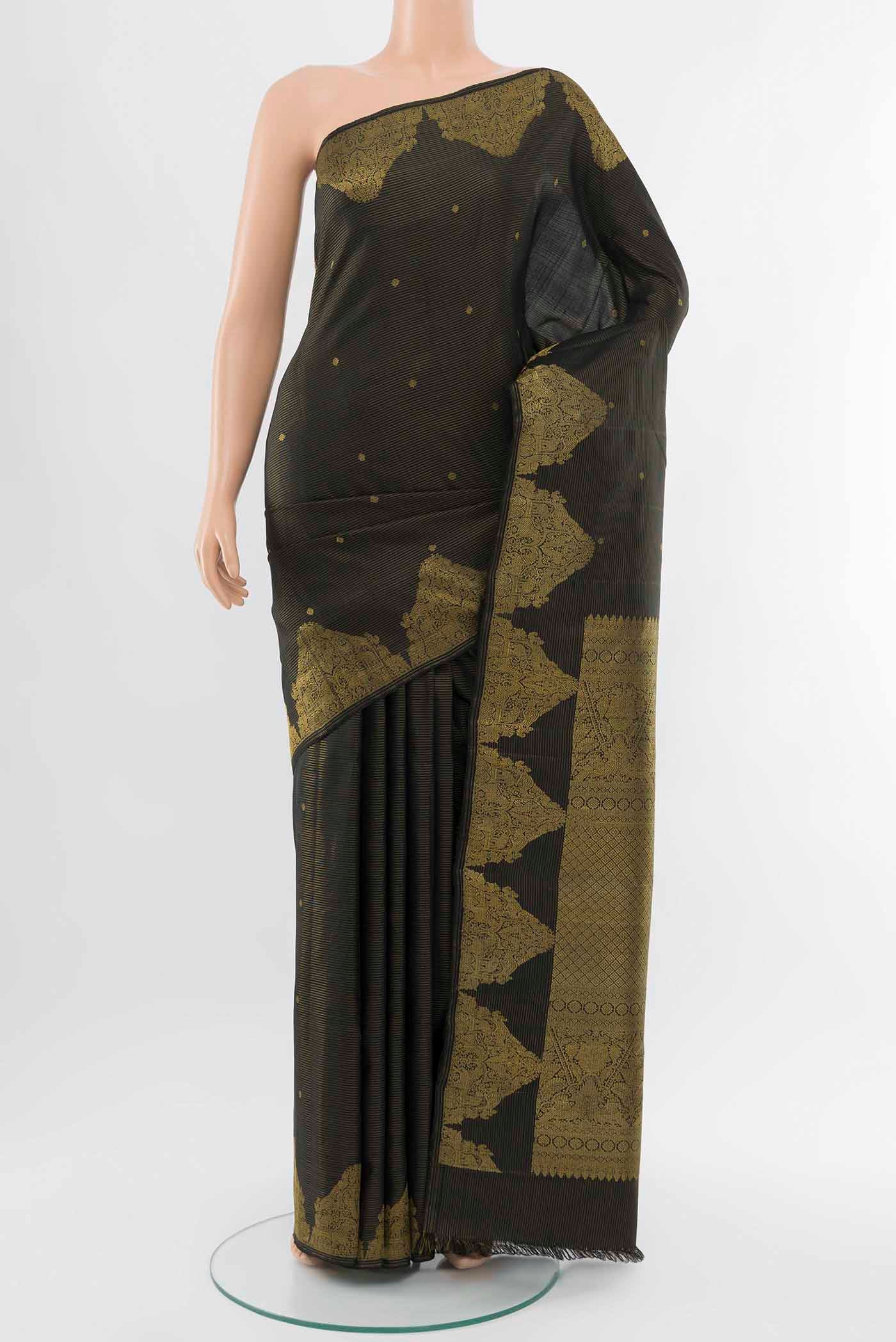 Black Kanchipuram Silk Saree with Zari Butta on the body and Silk Border displayed on a mannequin