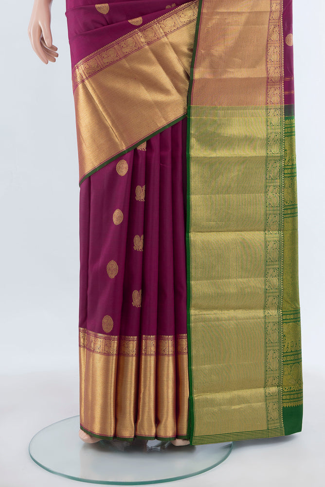 Pleats and pallu of Purple Kanjivaram Silk Saree with Zari Butta on the body and Silk Border. 